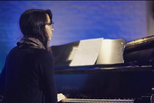Jennifer Giammanco accompanying one of her students at a music recital